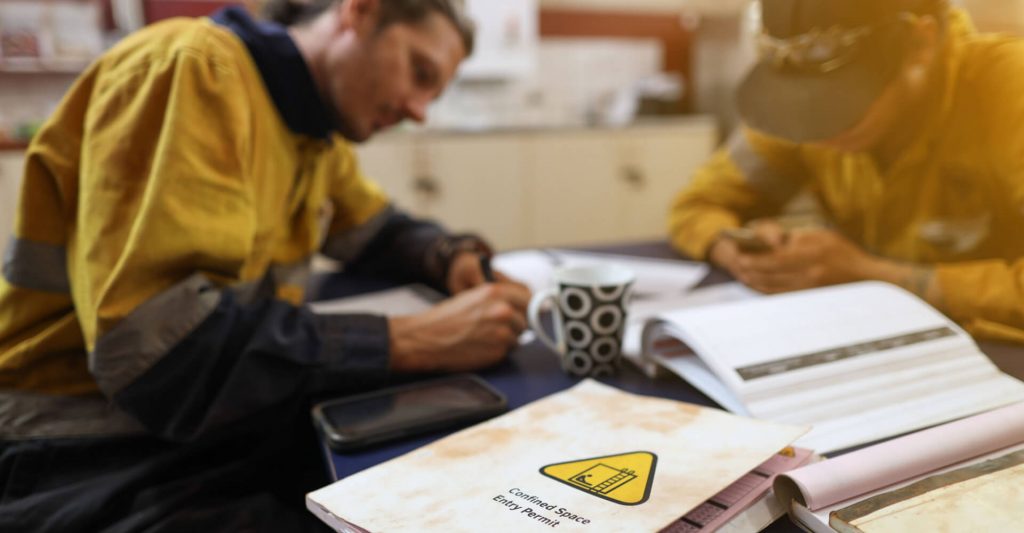 Man sitting at desk studying or taking an exam